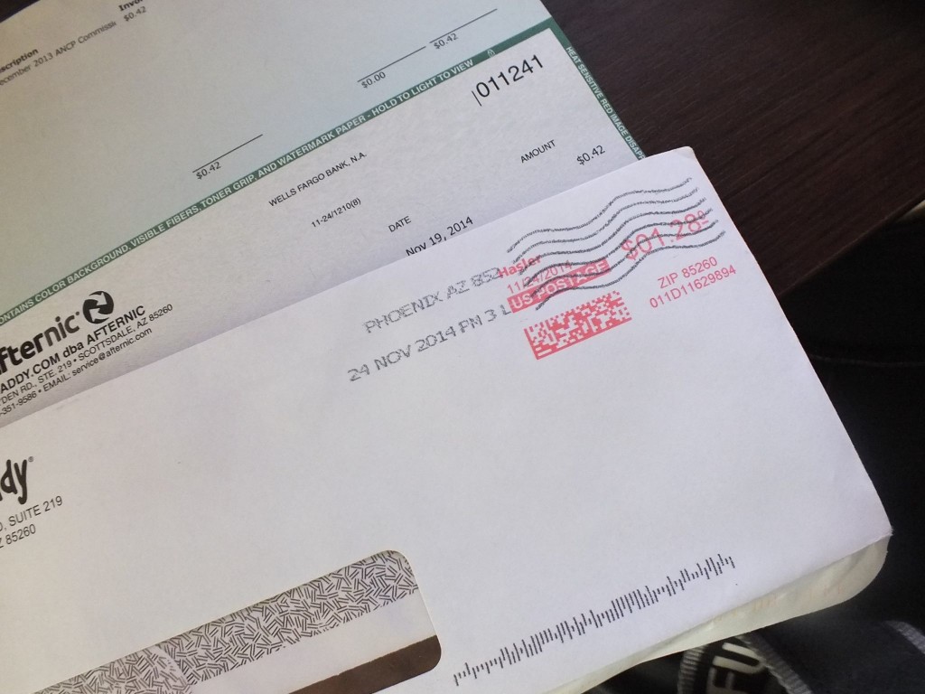 A check from GoDaddy for the amount of $0.47 cost $1.28 to mail. 